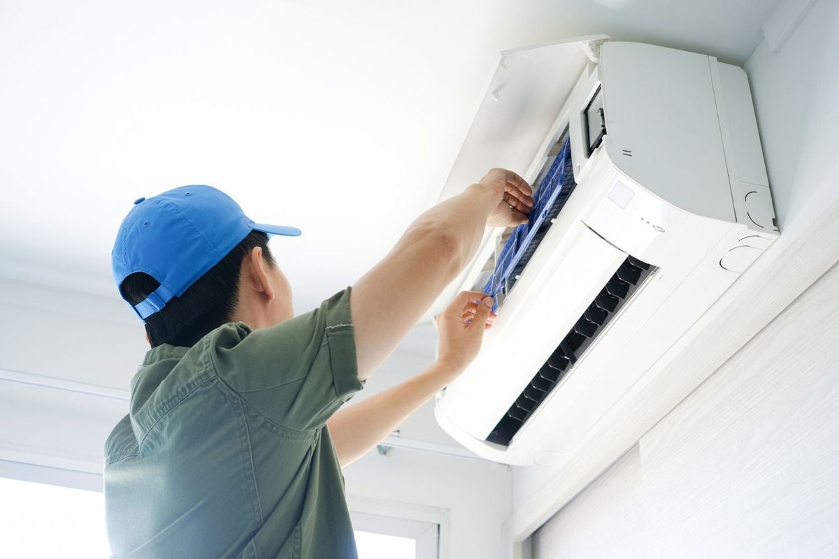 ComfortPro HVAC technician helping a homeowner